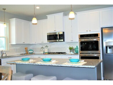 The cabinets and center island in this kitchen are