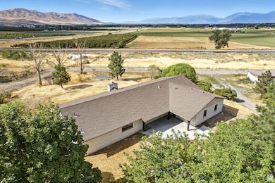 Overview of rural landscape with farmland and a mountainous background