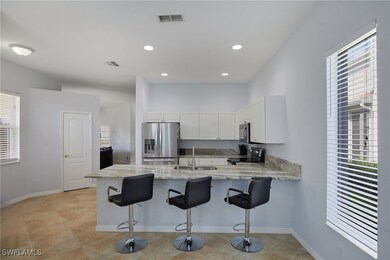 Kitchen with appliances with stainless steel finis