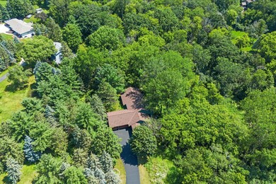 Welcome home! Enjoy the privacy and walking the trails of 1.99 acres of beautiful gardens, tranquil water feature and zennie living!