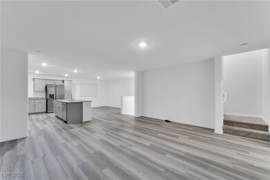 Unfurnished living room featuring recessed lightin