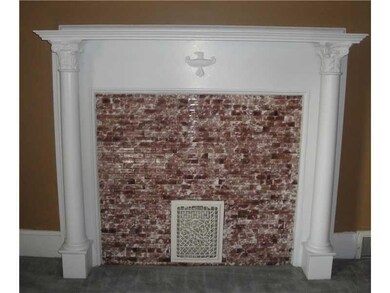 Living Room. Decorative fireplace with mantle and 