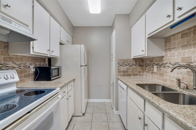 Terrific kitchen with great tile and countertops.