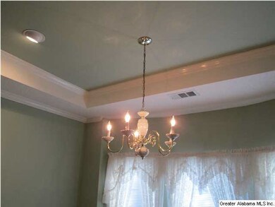 Dining room.  Note the deep crown molding and trey