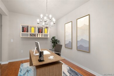Office with an inviting chandelier and hardwood /