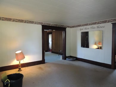 Living Room leads into the Dining Room.  Mirror stays!