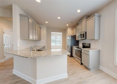 Kitchen featuring appliances with stainless steel 