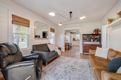 Also, showcases a shiplap accent wall, adding a touch of rustic charm and visual interest to the space.