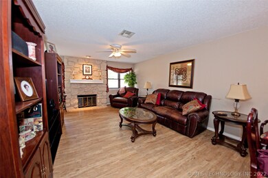 To the right of the fireplace is the front door -