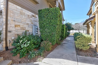 View of side of property featuring stone siding