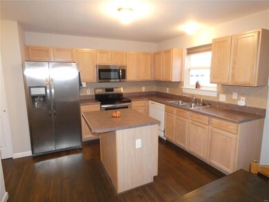 Convenient kitchen with lots of attractive maple c