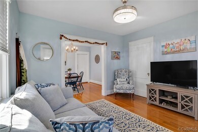 Living room with an inviting chandelier and light