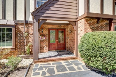 Welcoming Covered Front Porch with Custom Front Do