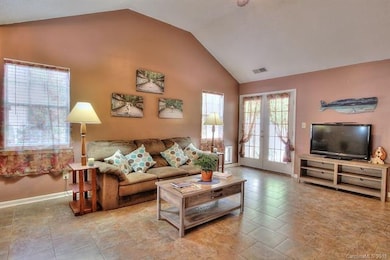 Tiled family room with vaulted ceiling. **Doggy do