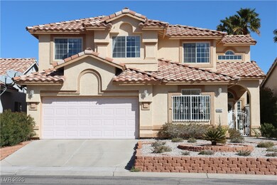Mediterranean / spanish-style house featuring a ti