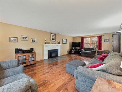 Living room with a wood burning fireplace insert