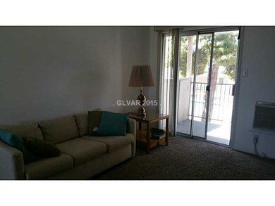 Property Photo. Living room with balcony