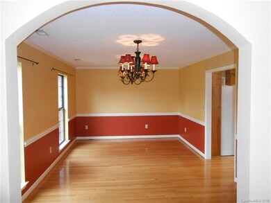 The formal dining room has 2 chandeliers