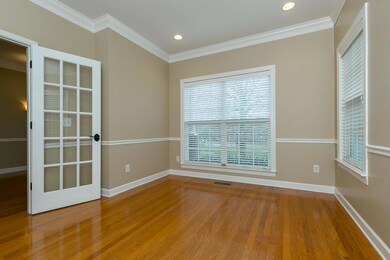 Light and bright front room - featuring hardwood floors - possible office/den/music room...Many possibilities!!!