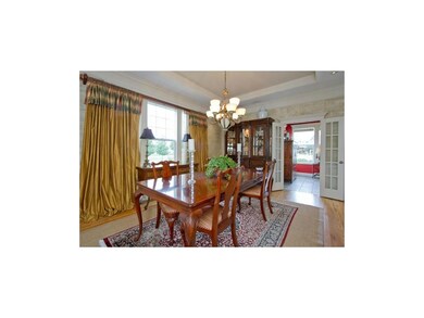 Elegant formal dining with custom faux painted wal