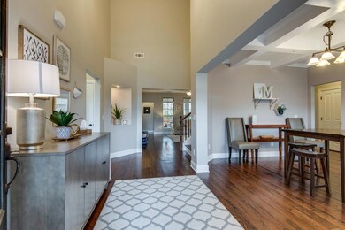 The entry foyer offers a high ceiling and shows off the great flow to this home's floor plan.  The entire first floor has been repainted.
