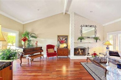 View of Step Down Living Room with Cathedral Ceili