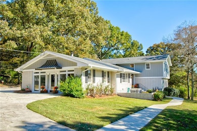 Great Room entry of property with brick siding and a lawn
