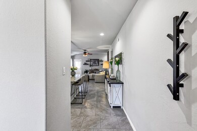 The foyer is welcoming and the home office is just to the left of the door.