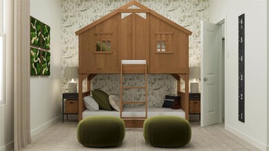 Living area featuring baseboards and wallpapered w