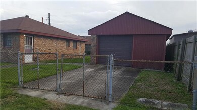 Detached garage in rear enters from Dinkins Street