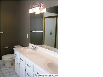 Dual vanities, cultured marble, ceramic tile, and 