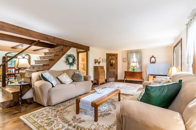 Spacious living with with stairs up to b