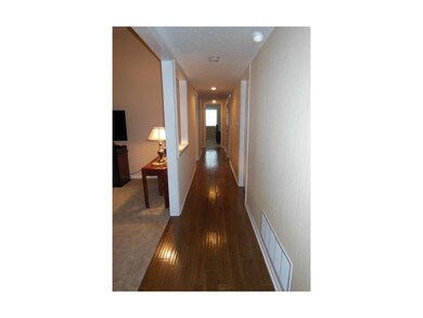 Main hallway shows fantastic wood floors.