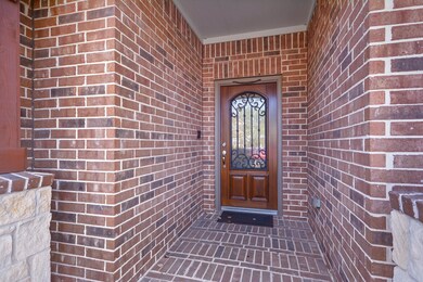 Nice wood front door with iron accents.