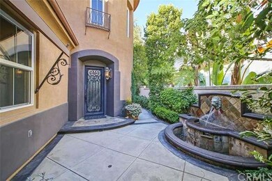 Front door with welcoming fountain.