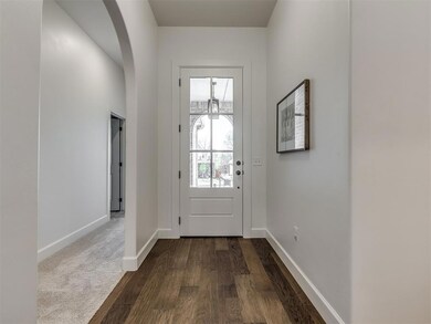 Entryway featuring dark carpet