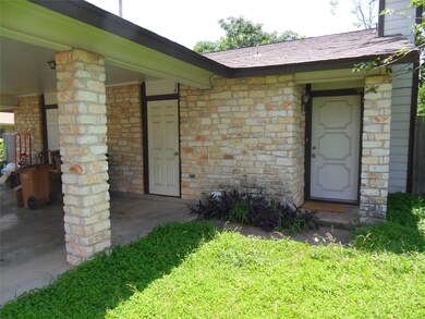 View of exterior entry featuring a shingled roof,