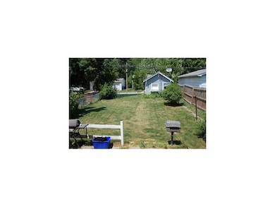 Exterior Back. Fenced back yard, not too big, not 