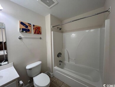Full bathroom featuring tile patterned floors, bat