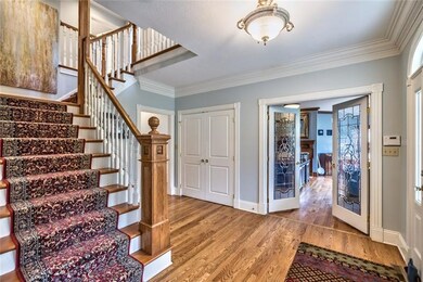 2 Story Hardwood Floor Entry Foyer.