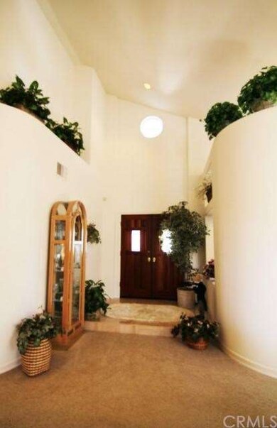 Double Door Entry Highlighted with two story ceili