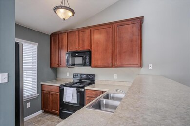 Kitchen, bar height counter with sitting area.