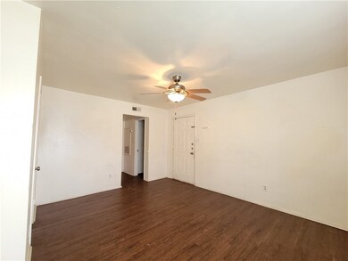 Unfurnished room featuring dark wood finished floo