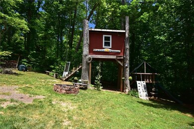 Tree House in the Backyard and a Fire Pit