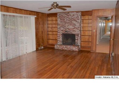 Large den upstairs with brick wood burning firepla