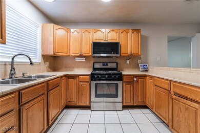 Kitchen featuring stainless steel appliances, a si