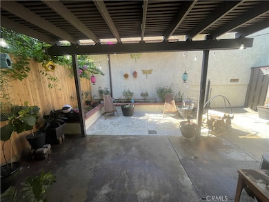 Back Yard Low Maintenance, Completed cemented with raised flower beds.