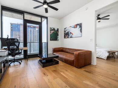 Living area with light wood-style floors, ceiling