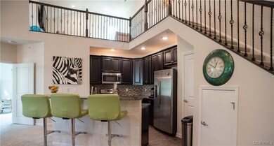 Breakfast island features granite countertops and