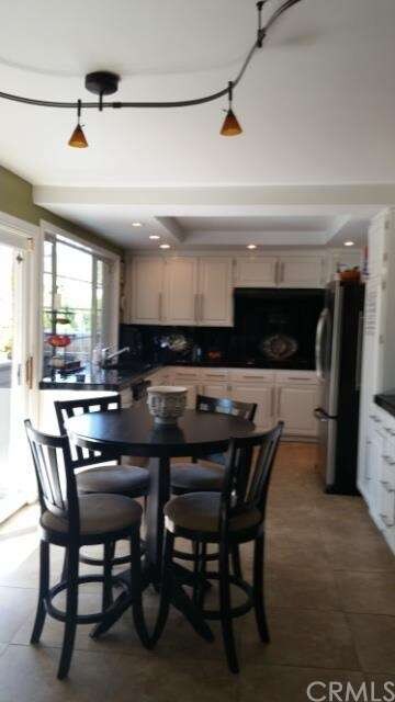 Kitchen with eating area and view of patio.